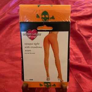 Music Legs Tights with Crossbone Seam one size fits most. New in packaging.